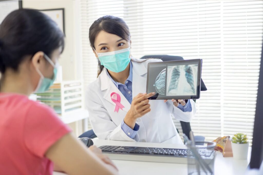 Doctor describing breast cancer screening to patient